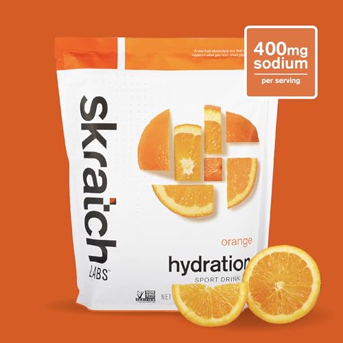 Skratch Labs Hydration Orange tub closeup showing real-fruit powder and clean ingredients.