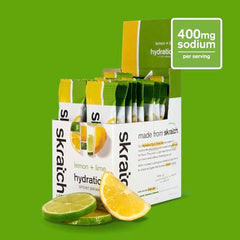 Open lemon-lime hydration packet pouring into water for on-the-go fueling.
