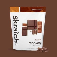 Skratch Labs Recovery Chocolate dissolving scoop demonstrates easy mix for quick refuel.