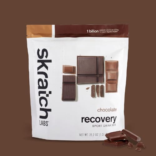 Skratch Labs recovery drink chocolate bottle being poured, refreshing hydration after training.