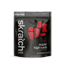 Skratch Labs Super High-Carb Hydration Raspberry bottle pour for steady endurance energy.