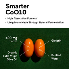 CoQ10 bottle beside organic olive oil on kitchen counter.