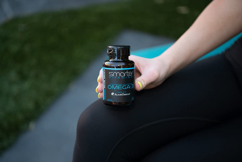 SmarterVitamins Omega-3 daily use scene with bottle and glass of water