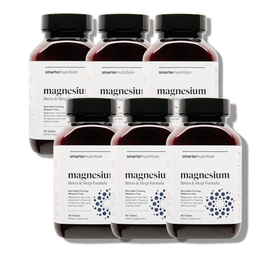 Smarter Magnesium Complex bottle on nightstand suggesting sleep support.