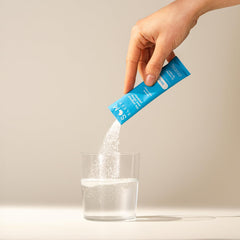 Travel-ready Som Sleep sticks on a nightstand ready for jet lag relief.