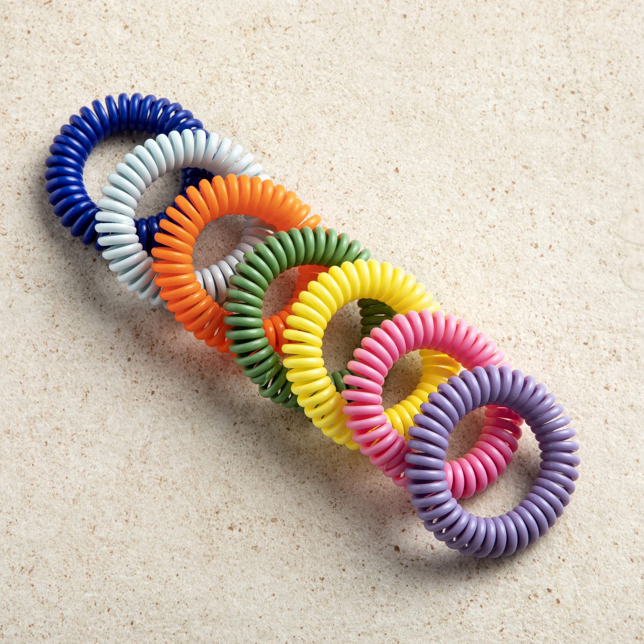 SOULSATION kids and adults wearing DEET-free bands for outdoor comfort.