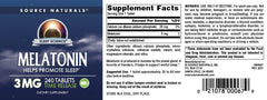 Source Naturals Melatonin tablets close-up showing round pills and smooth texture.
