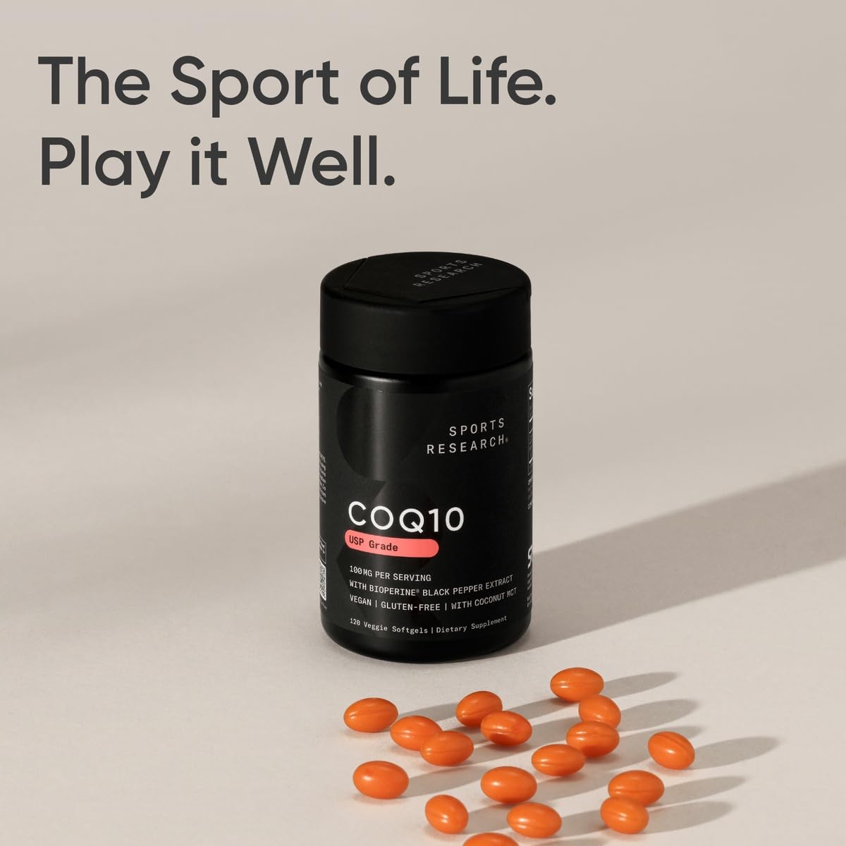 Sports Research CoQ10 bottle beside a glass of water for daily use.