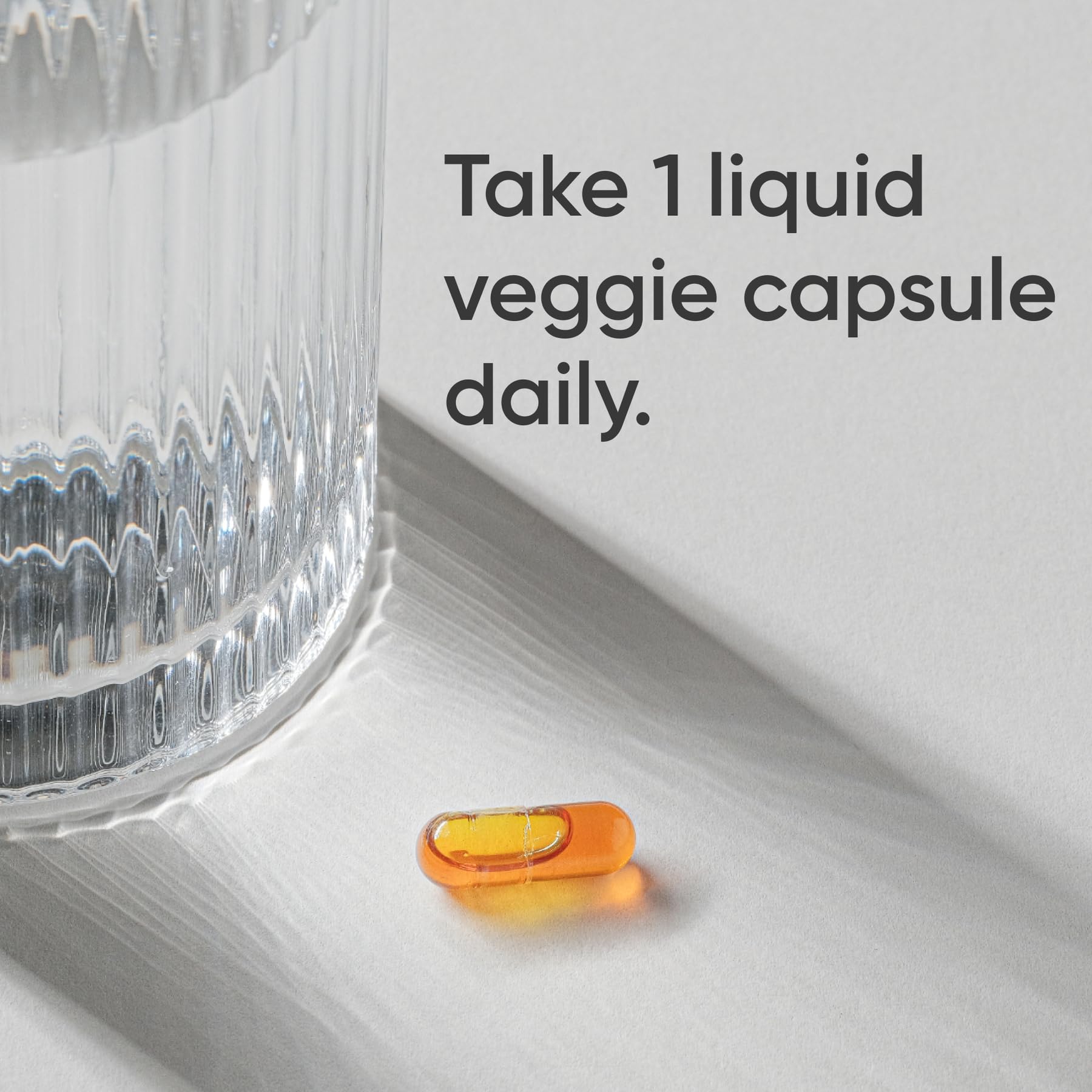 Sports Research Phytoceramides capsules poured to illustrate easy daily use.
