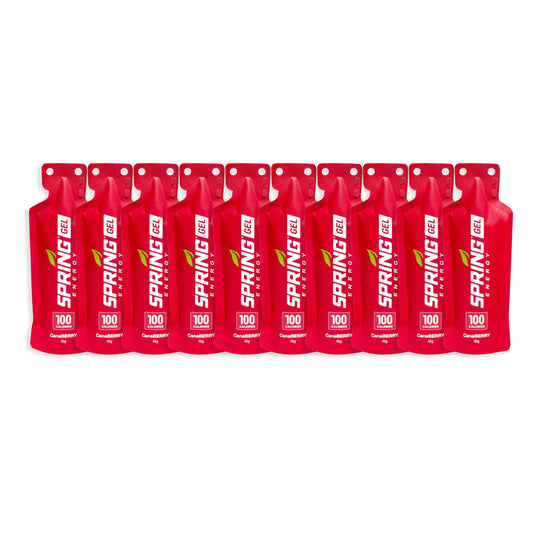 Spring Energy Canaberry bottle front view highlighting strawberry smoothie flavor for endurance fueling.