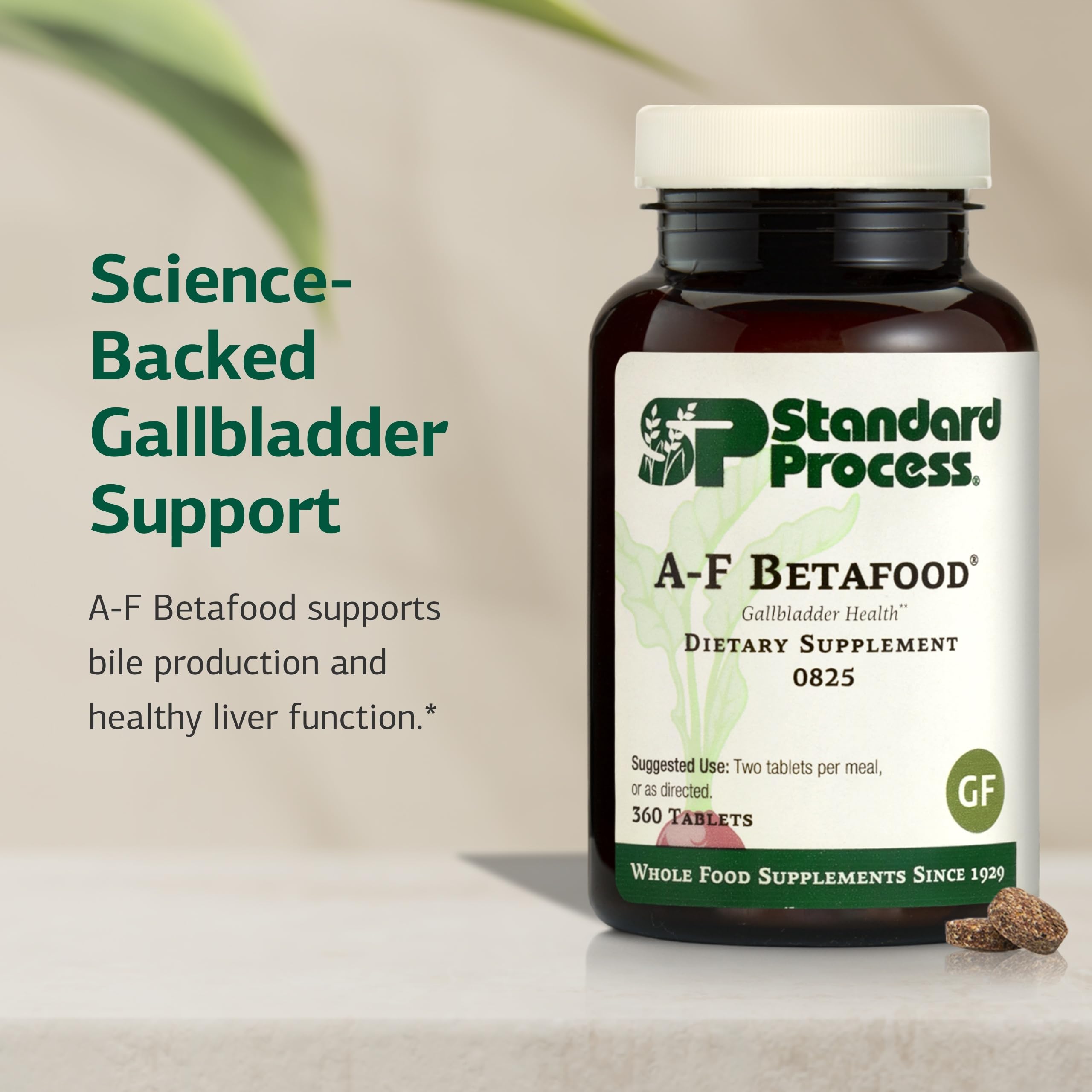 Close-up of Standard Process A-F Betafood tablets for bile production support.