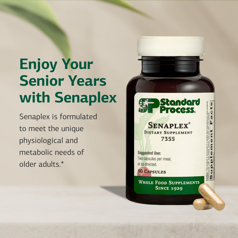 Standard Process Senaplex bottle on table showing non-dairy formulation for daily wellness.