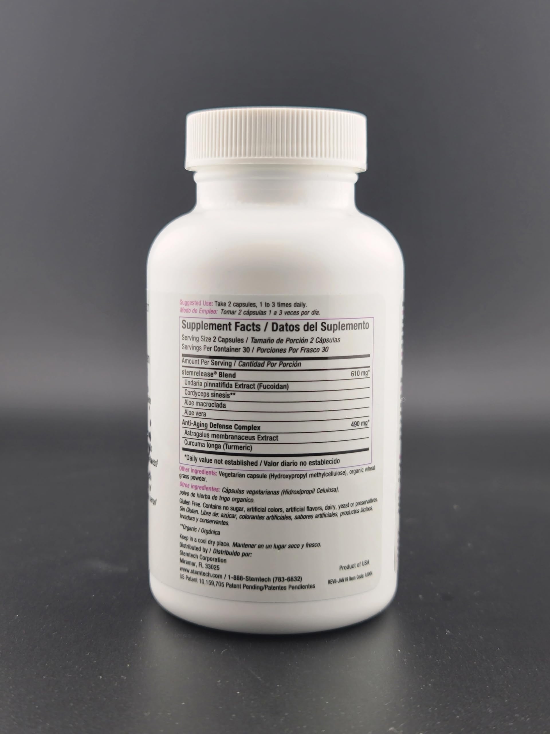 StemTech StemRelease3 bottle with glass and pills on white surface illustrating daily use