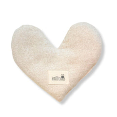Stillnus weighted heart eye pillow closeup for calming pressure during relaxation.