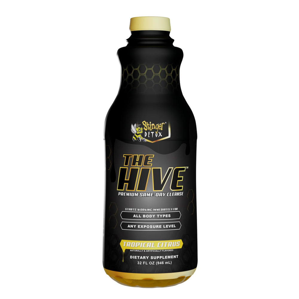 Stinger Detox The Hive serving shot with glass emphasizes tropical citrus flavor.