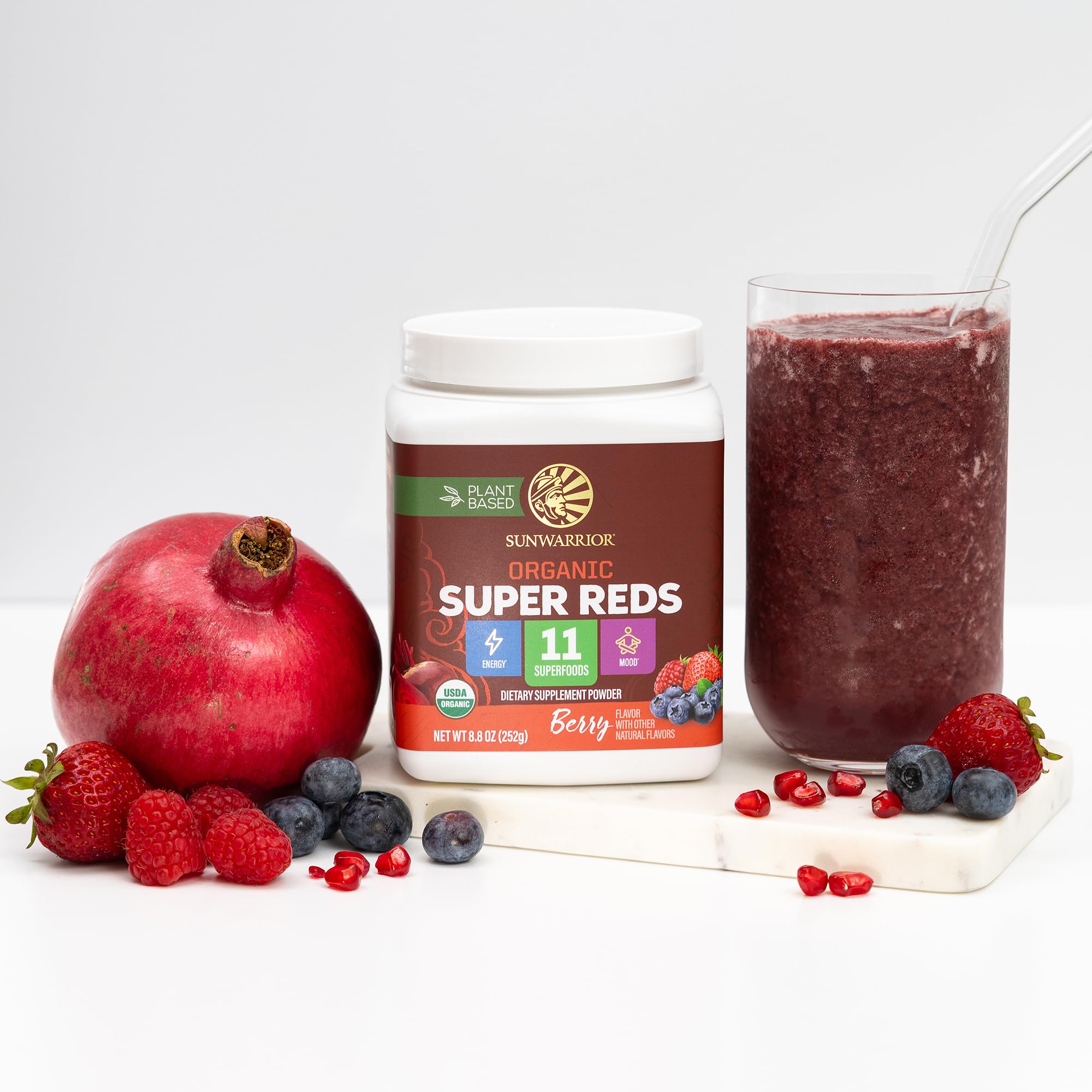 Sunwarrior Organic Super Reds mixed in water glass shows a refreshing nutrient-rich drink.