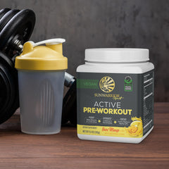 Sunwarrior Pre Workout glass with cold water ready for training session.
