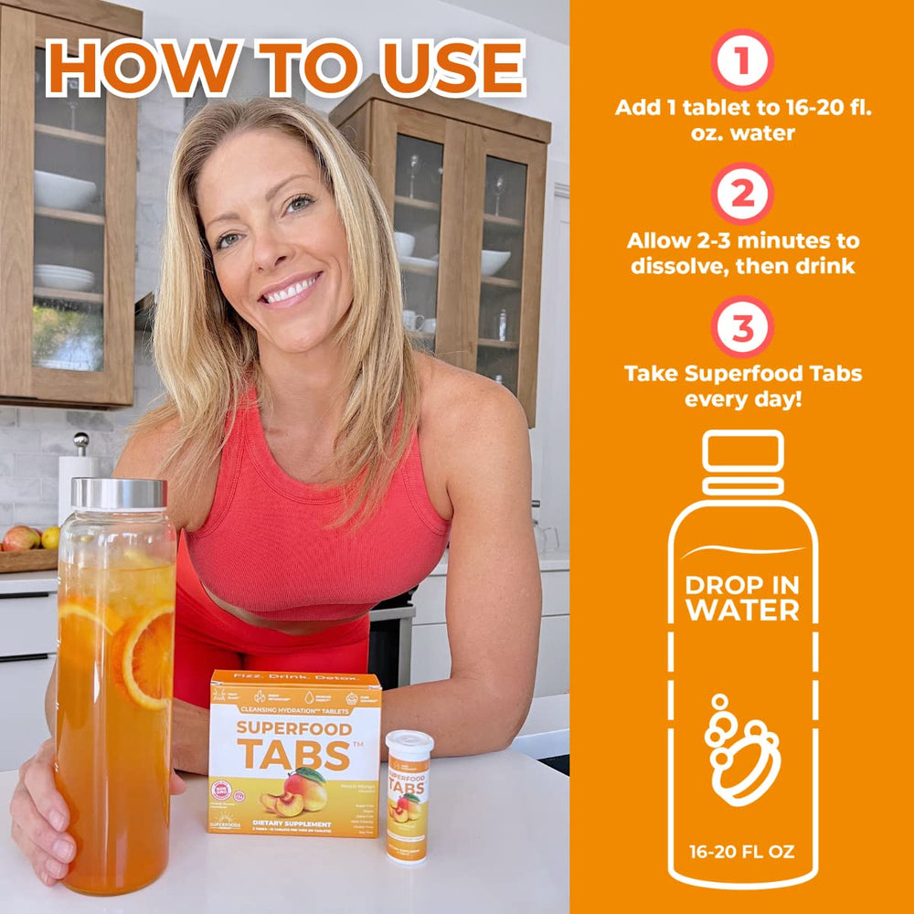 Superfood Tabs Peach Mango glass serving shows a refreshing, sugar-free energy lift.
