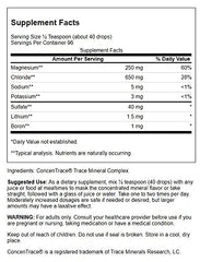 Swanson Concentrace trace mineral drops being poured into a glass of water.