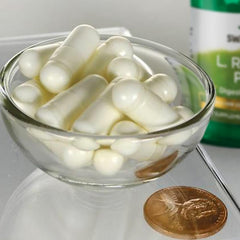 Swanson L. Reuteri Probiotic Plus capsules in hand for easy daily intake