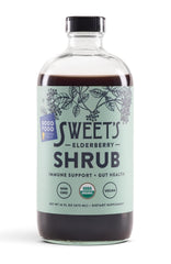 Sweet's Elderberry Shrub bottle on a table for everyday wellness