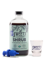 Close-up of ginger in Sweet's Elderberry Shrub highlighting fresh ingredients