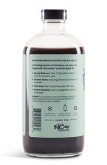 Glass with sparkling water and Sweet's Elderberry Shrub as a natural mixer