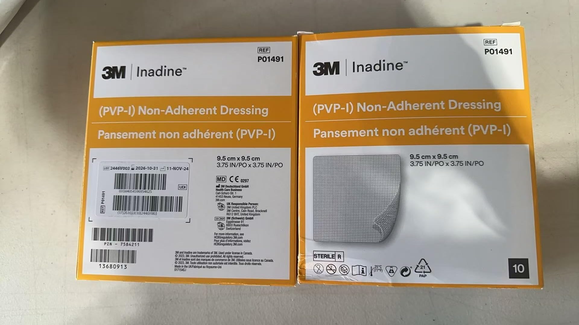 Systagenix Inadine dressing applied to wound with non-adherent contact and iodine coverage.
