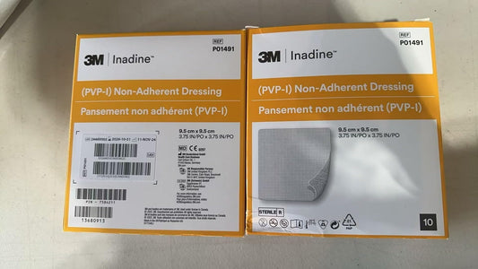 Systagenix Inadine dressing applied to wound with non-adherent contact and iodine coverage.