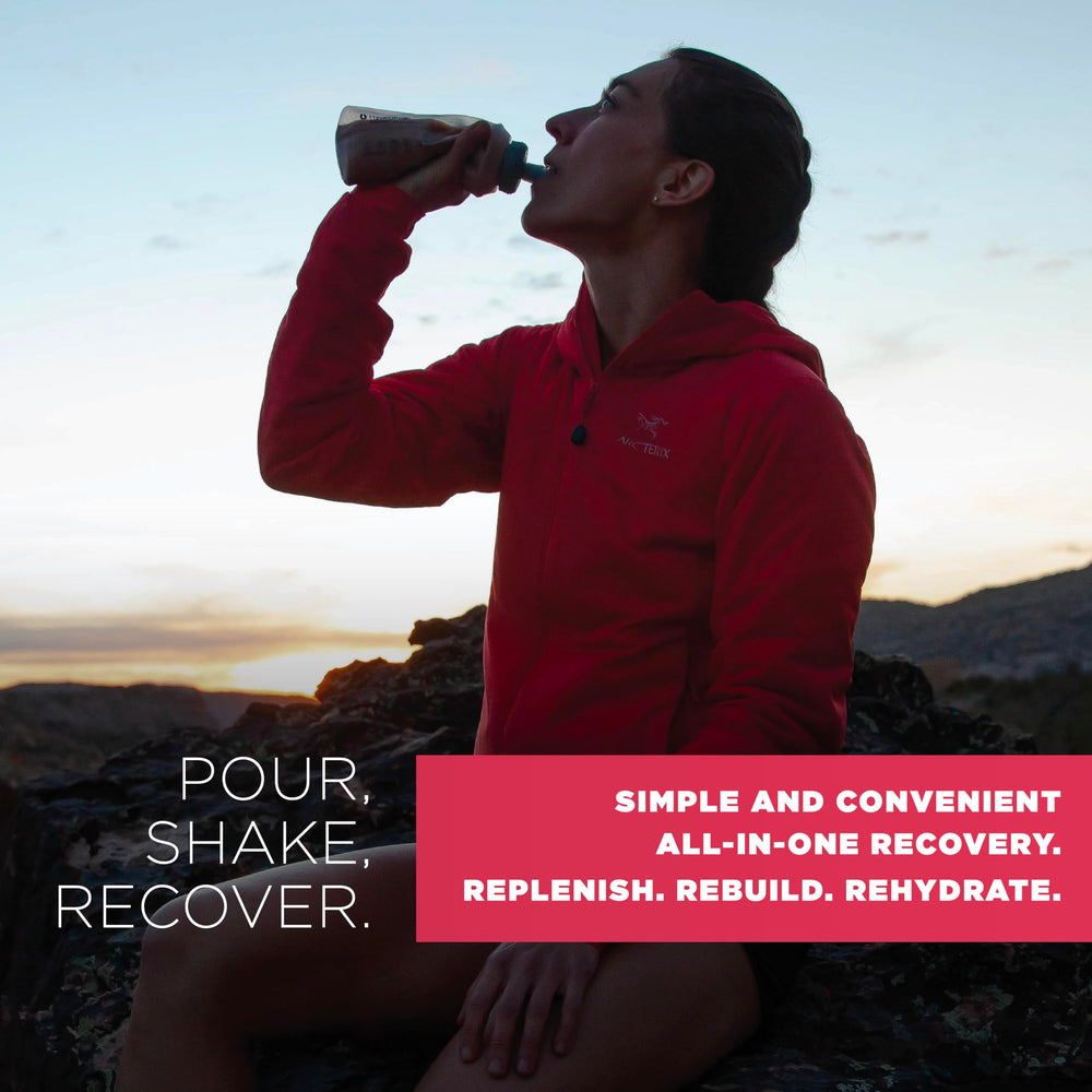 Tailwind Recovery Mix bottle being shaken with powder