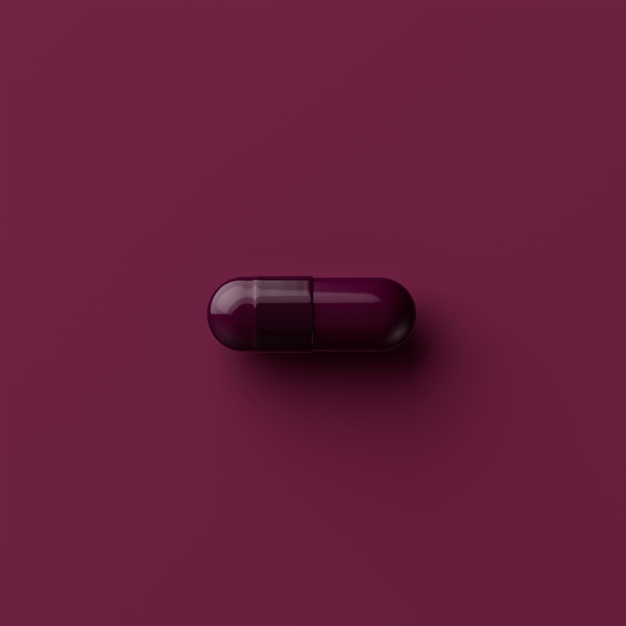 Tally Health capsules in hand illustrate simple dosing for daily wellness goals.