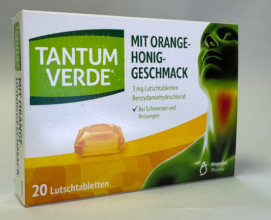 Tantum Verde orange-honey lozenges close-up showing fruity flavor and smooth texture.