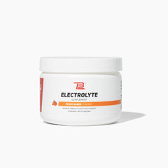 TB12 Electrolyte Powder Peach Mango jar label close-up showing mineral-rich hydration benefits