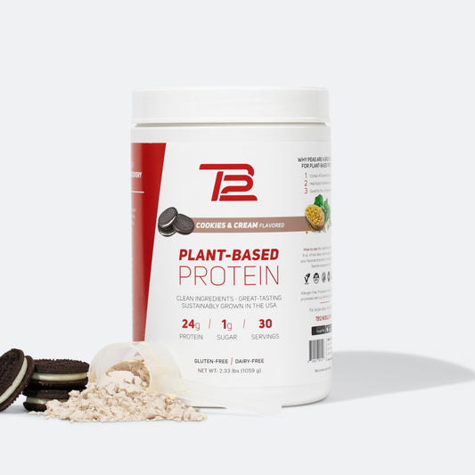 TB12 cookies and cream plant based protein powder tub ready for a post-workout shake