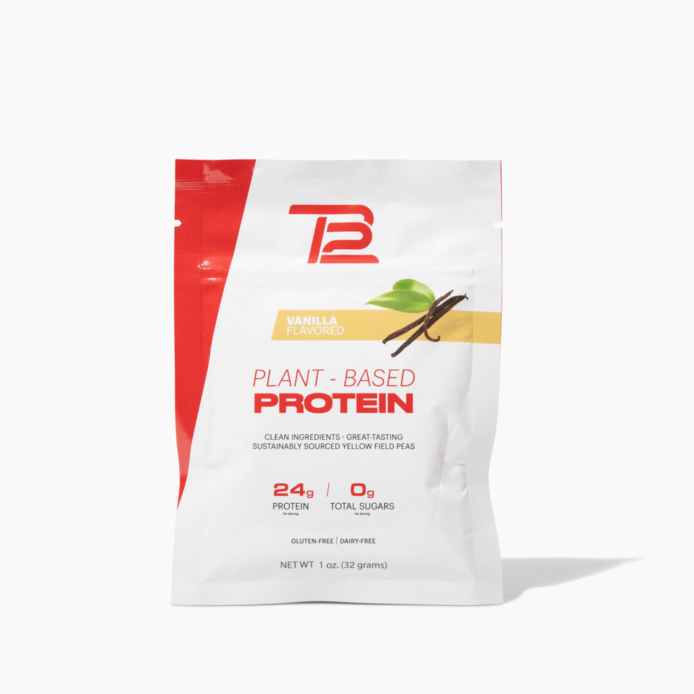 TB12 vanilla plant-based protein powder with scoop ready to blend into a dairy-free shake