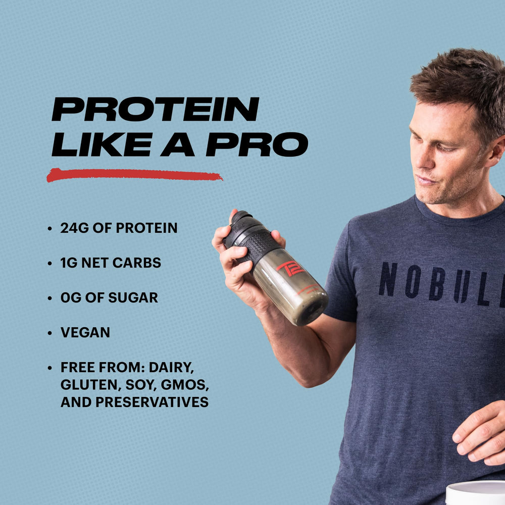 TB12 shake glass with protein powder ready for a delicious vegan shake