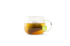 Tea Botanics Night Sweat Tea cup steeping for a calming bedtime moment.