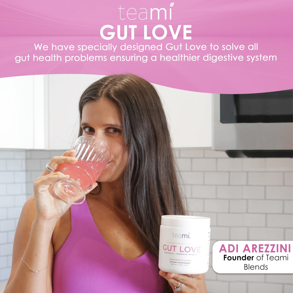Glass of water with Teami Gut Love powder dissolving smoothly.