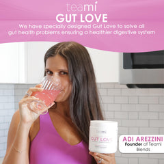 Glass of water with Teami Gut Love powder dissolving smoothly.
