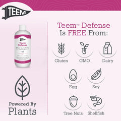Teem Defense glass next to spoon ready to mix the whole biotic tonic.