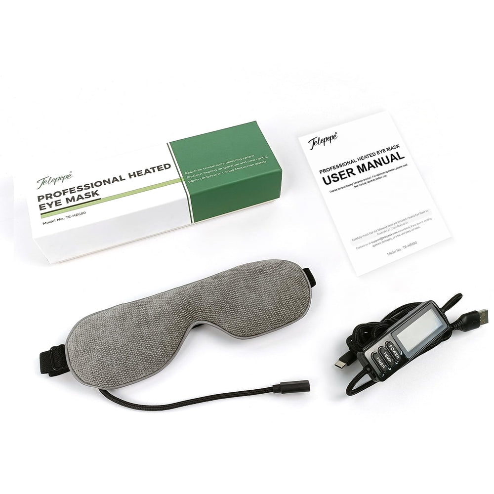 Telepepe heated eye mask in grey used during travel for rest.