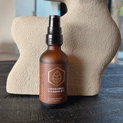 Terra Health Essentials Liposomal B12 packaging box beside bottle for convenient daily supplementation.