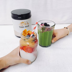 Terra Origin collagen peptides vanilla smoothie-ready powder added to a glass