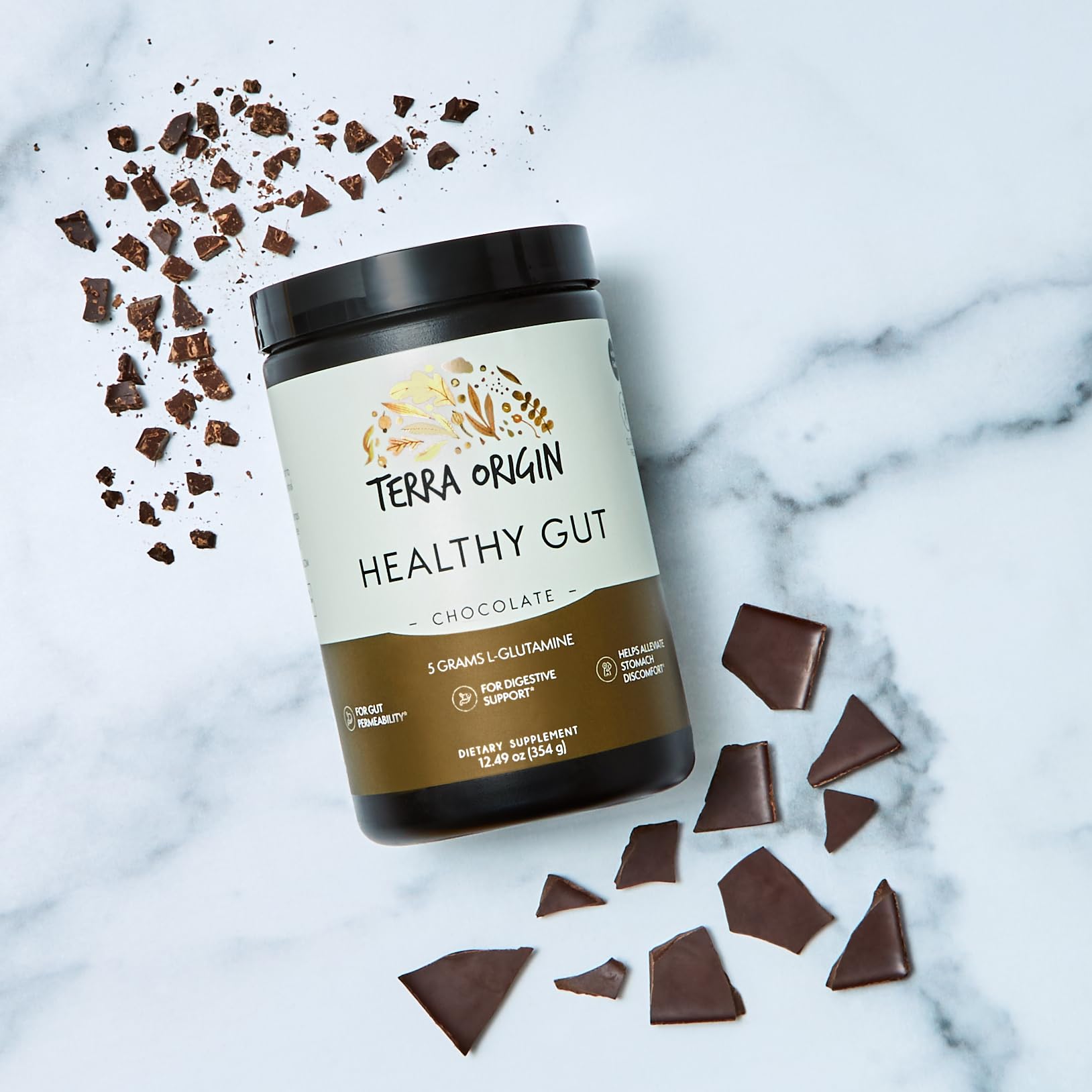 Terra Origin Healthy Gut Chocolate glass with powder being mixed smoothly