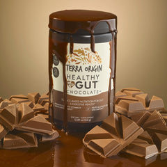 Terra Origin Healthy Gut Chocolate scoop pouring powder into a glass