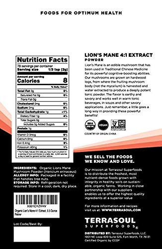 Terrasoul Lion's Mane powder being scooped for convenient daily use.