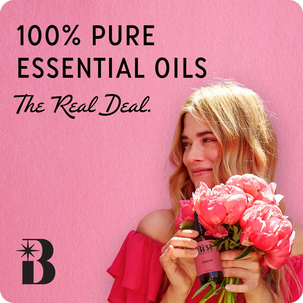 The Best Essential Oil Co Oud dropper pouring for easy diffusion and spa use.