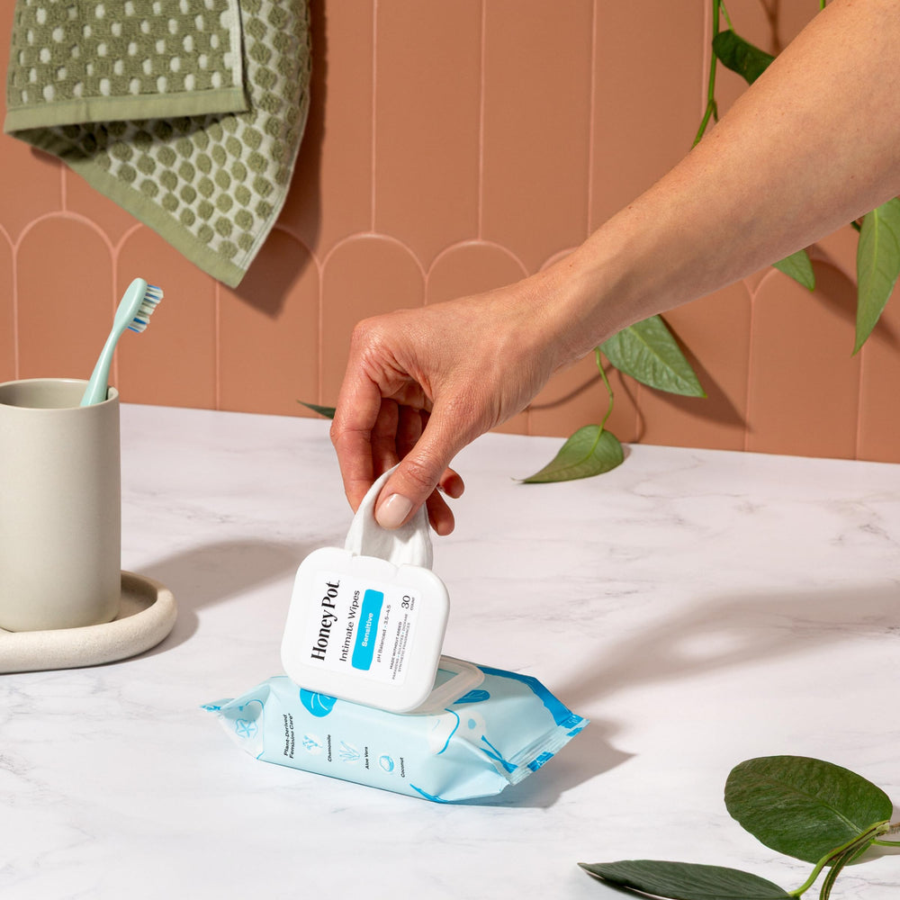 The Honey Pot Sensitive Feminine Wipes travel pack with resealable lid for on-the-go freshness.