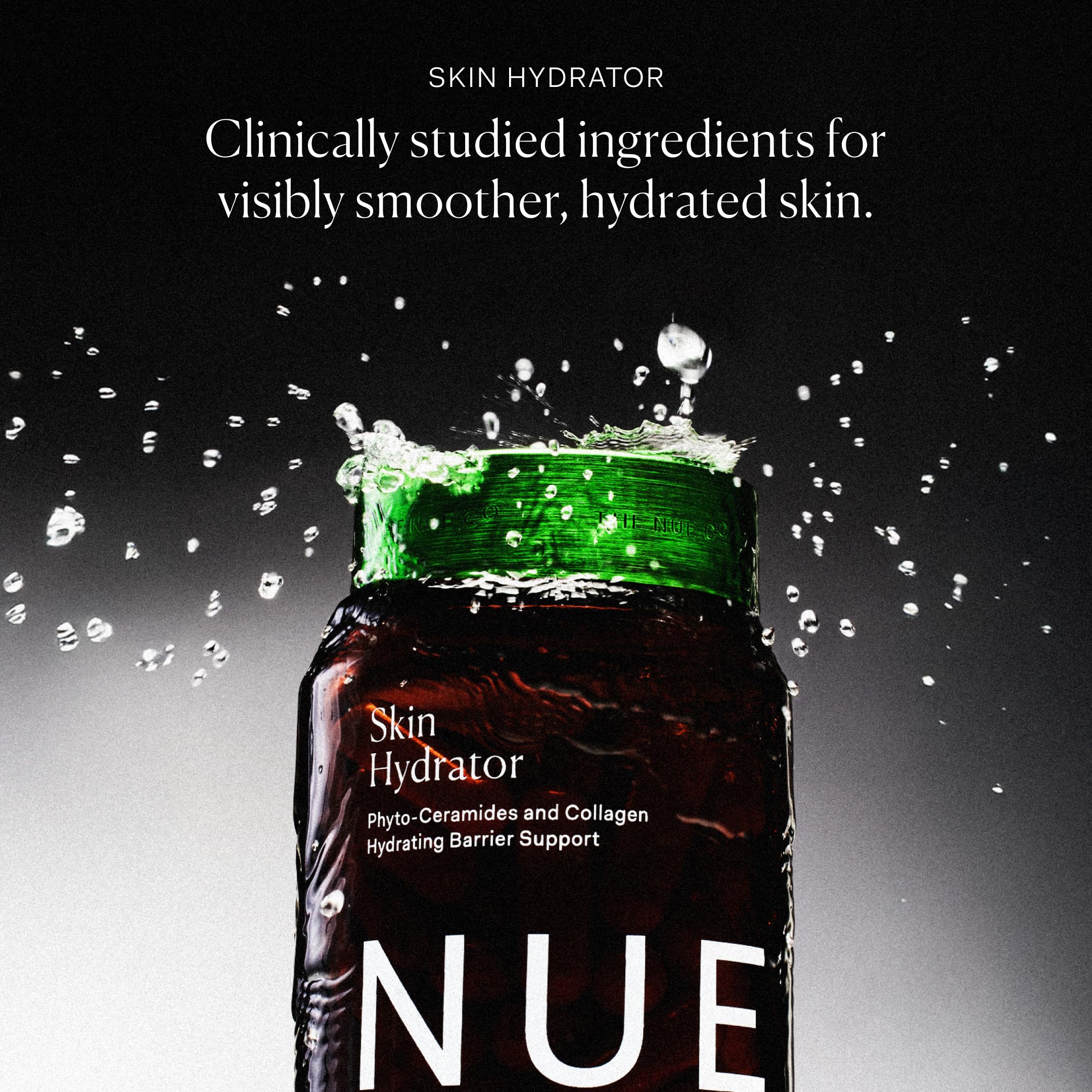 Glass bottle of The Nue Co Skin Hydrator on a bathroom shelf for daily use