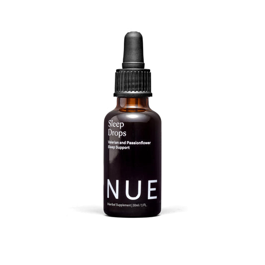 The Nue Co Sleep Drops bottle for a calm, simple bedtime routine.